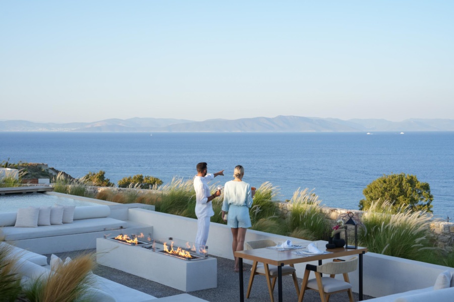 Couple gazing out into the endless blue of the Aegean, during their luxury Kos escape at KOIA All-Suite Wellbeing Resort.
